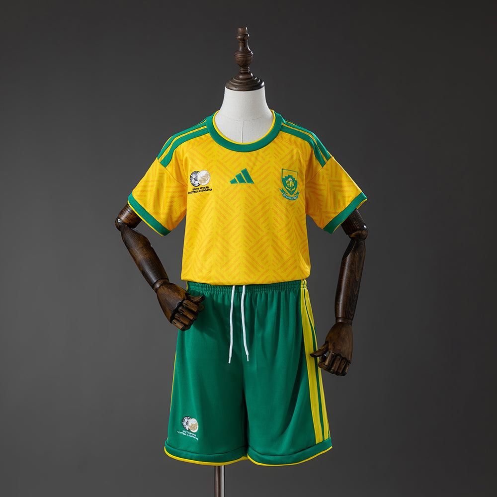 Sudafrica Casa 2026 - Bambino (pantaloncini inclusi)