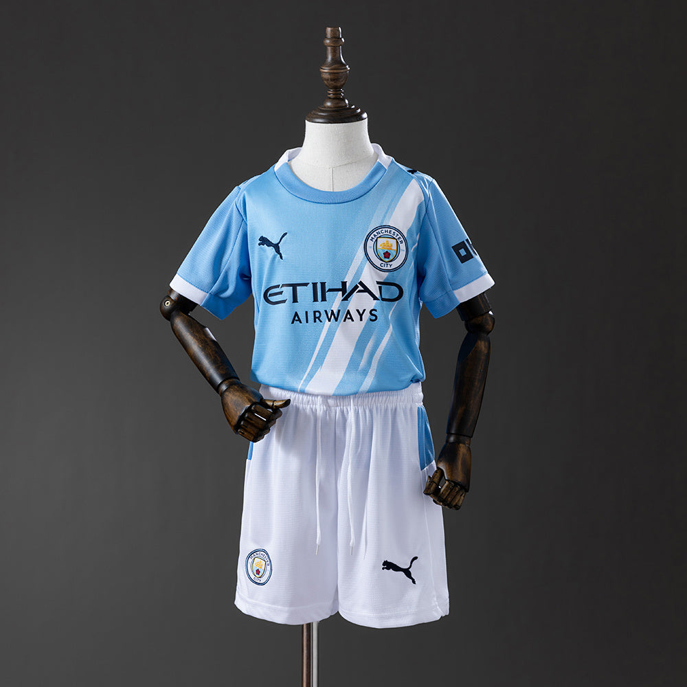Manchester City Casa 25/26 - Bambino (pantaloncini inclusi)